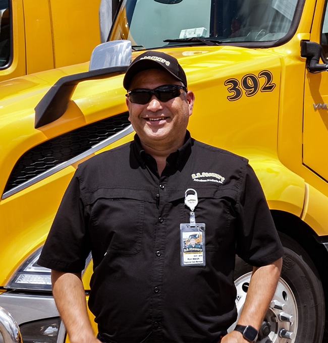 Driver standing by truck